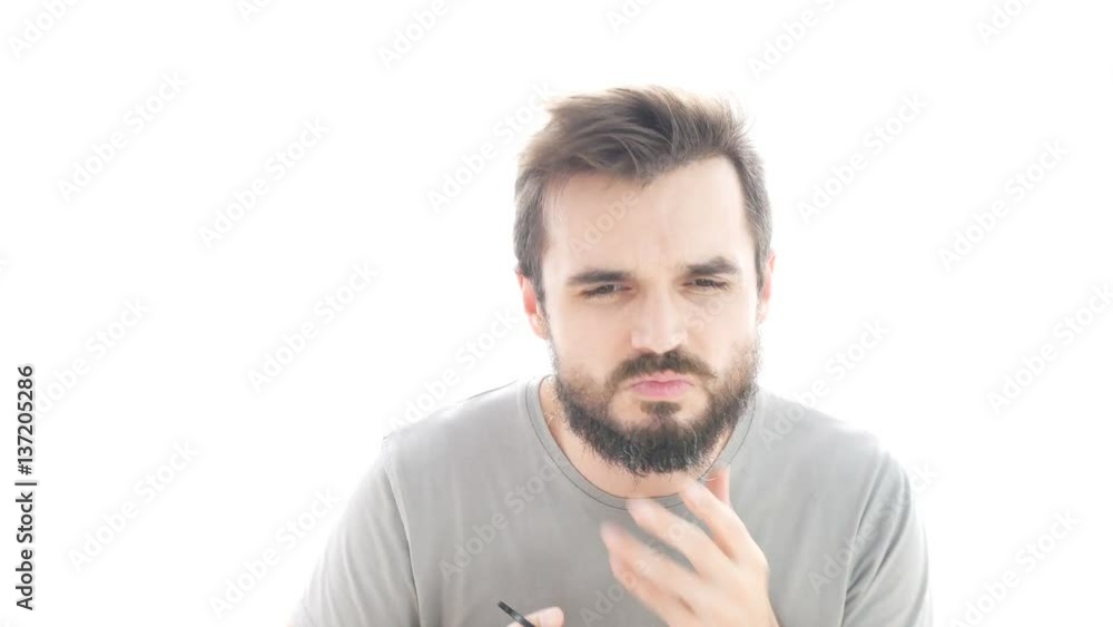 Time-lapse of bearded man cutting and shaving his beard and mustache with scissors and razor, studio isolated on white background. Time-lapse of bearded man cutting and shaving his beard and mustache with scissors and razor, studio isolated on white background.