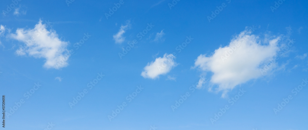 White clouds flying against blue sky. White clouds flying against blue sky.