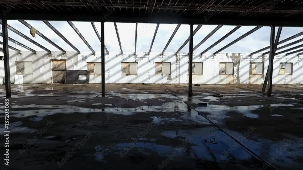Aerial shot of the interior of a rundown warehouse Aerial shot of the interior of a rundown warehouse