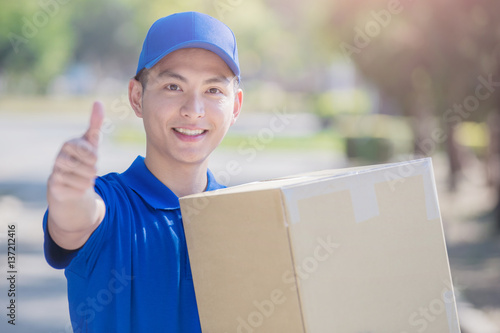 deliveryman stand and thumb up