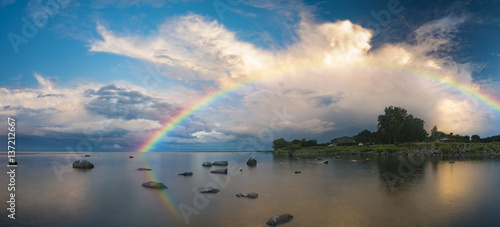 Fototapeta Naklejka Na Ścianę i Meble -  sea landscape at sunrise, boulders on the sea shore,rainbow