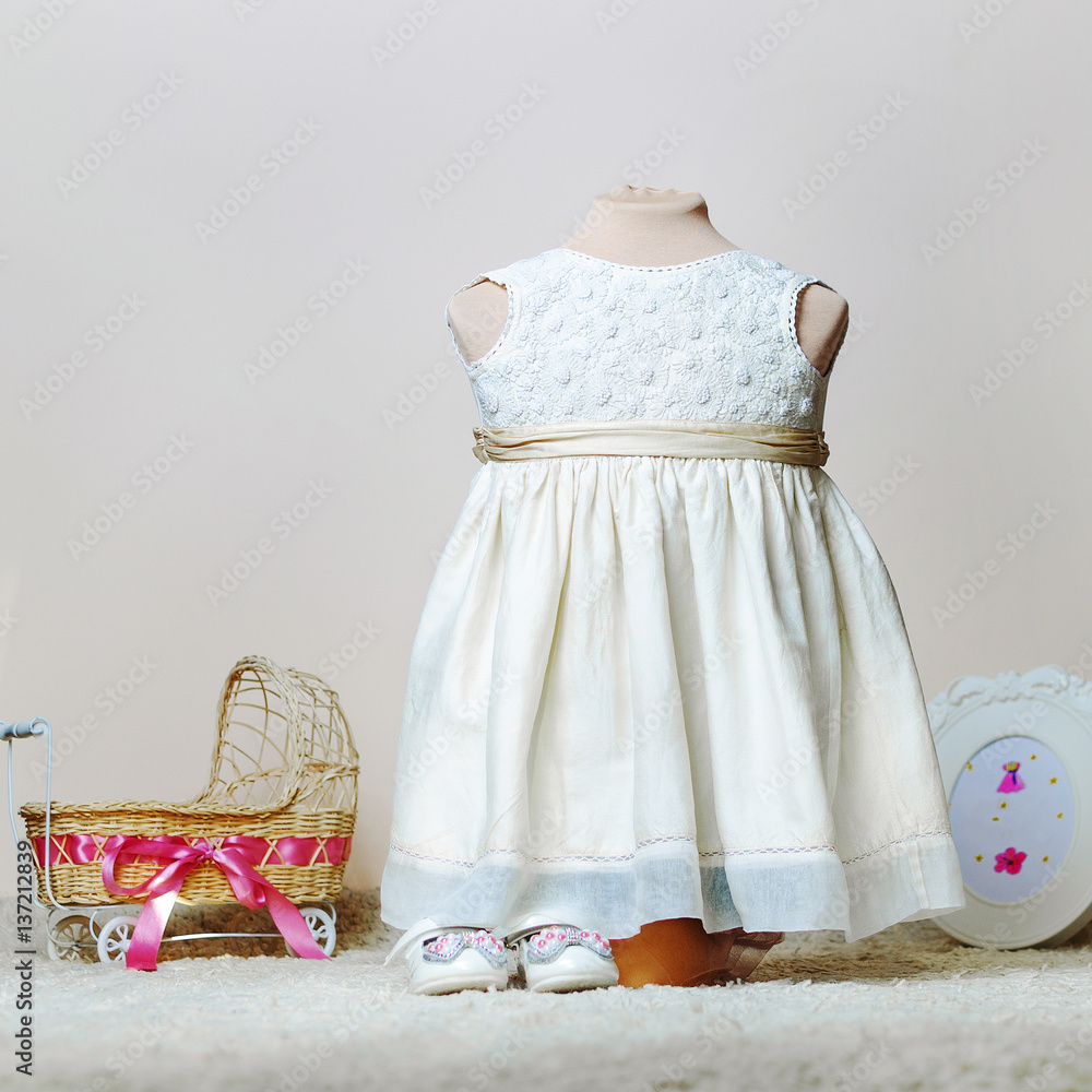 baby dress for a photo shoot on tailoring mannequin