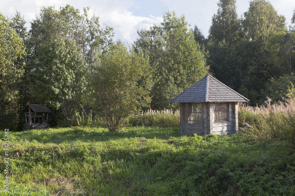 Equipped source and gazebo beside the road to the village Gorodischna, Nyuksensky District, Vologda Region, Russia