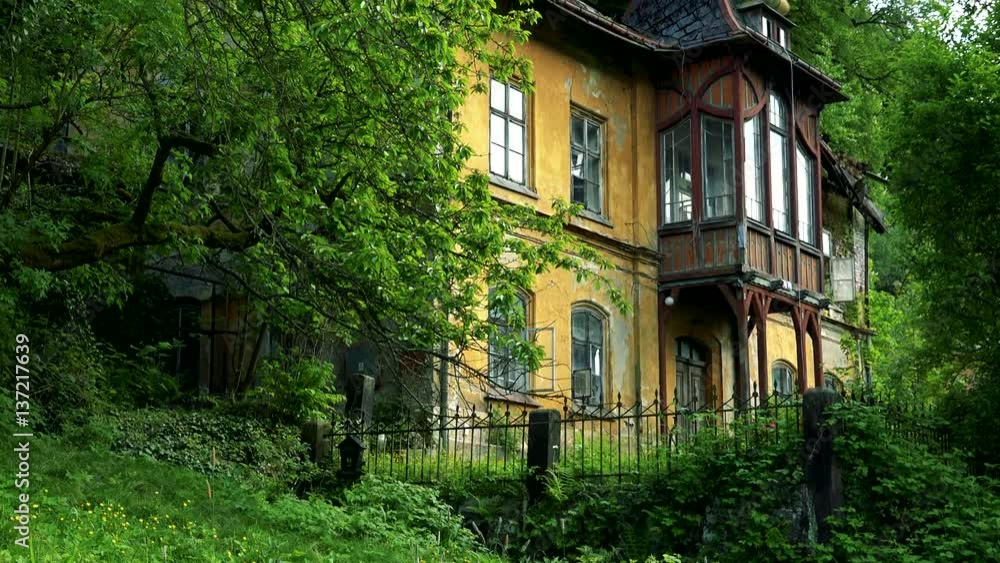 An old-fashioned house on the edge of a forest An old-fashioned house on the edge of a forest