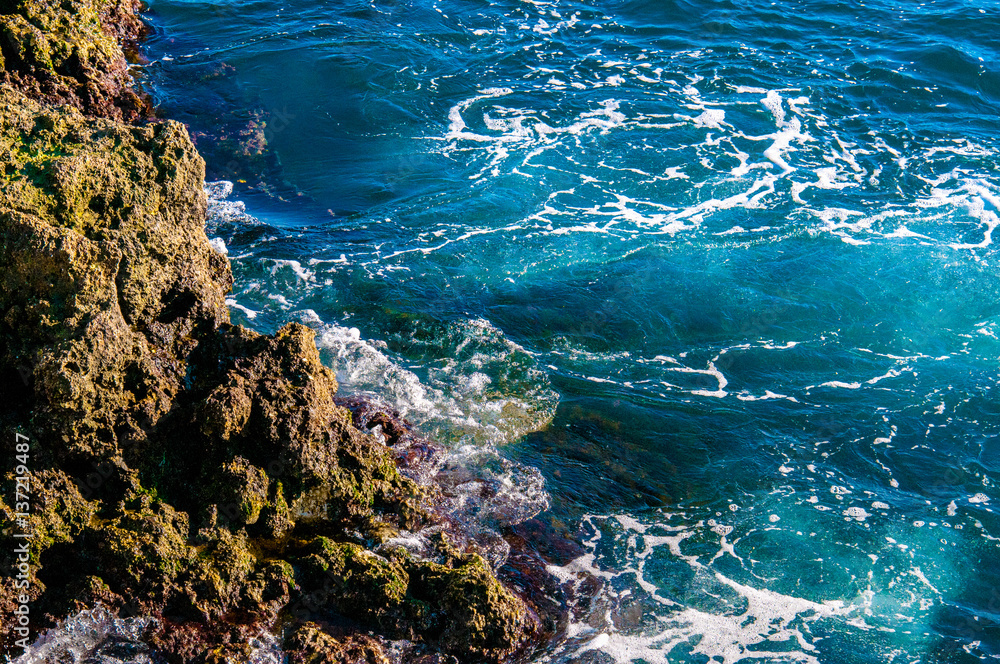 Beautiful natural rock of Australian beach. Amazing blue green sea and sunny day.