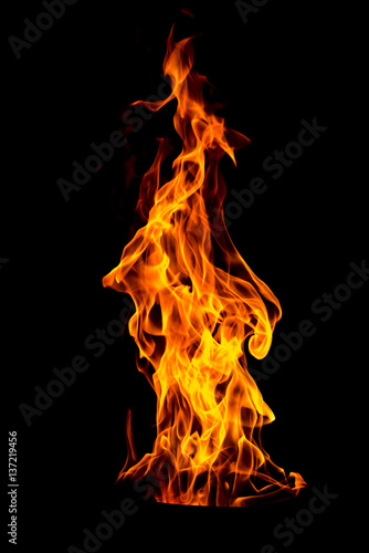 Fotografie, Tablou Fire flame isolated on black isolated background - Beautiful yellow, orange and red and red blaze fire flame texture style