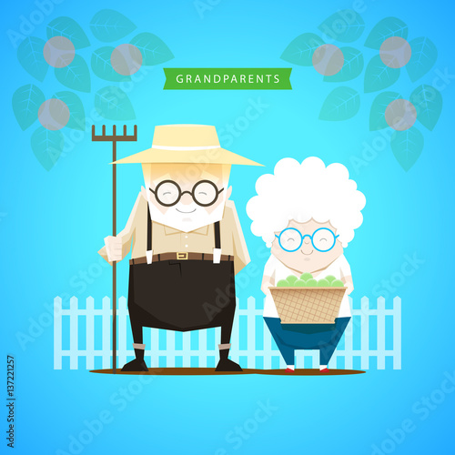 Grandparents harvest the apples in the garden