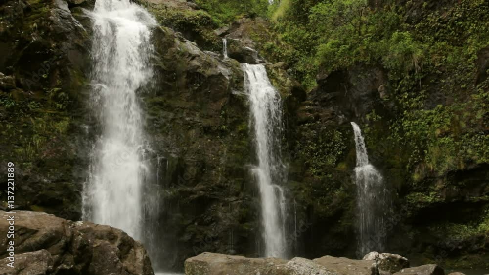 Upper Waikani Falls (also known as Three Bears Falls, since they range in size from large to small) from their base, along the well-known Road to Hana, Maui, Hawaii; includes ambient audio. Upper Waikani Falls (also known as Three Bears Falls, since they range in size from large to small) from their base, along the well-known Road to Hana, Maui, Hawaii; includes ambient audio.