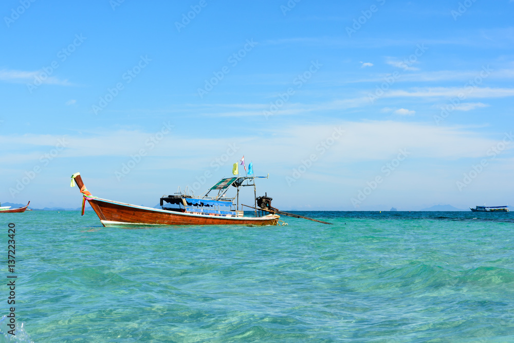 Wooden boats with clear water in koh Ngai, Trang, Thailand