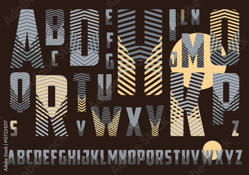 alphabet with crossing stripes pattern in dark brown and ivory