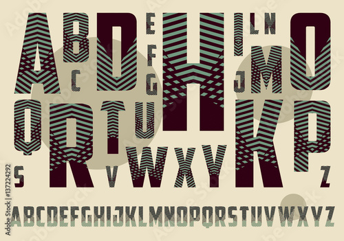 alphabet with crossing stripes pattern in dark brown and green