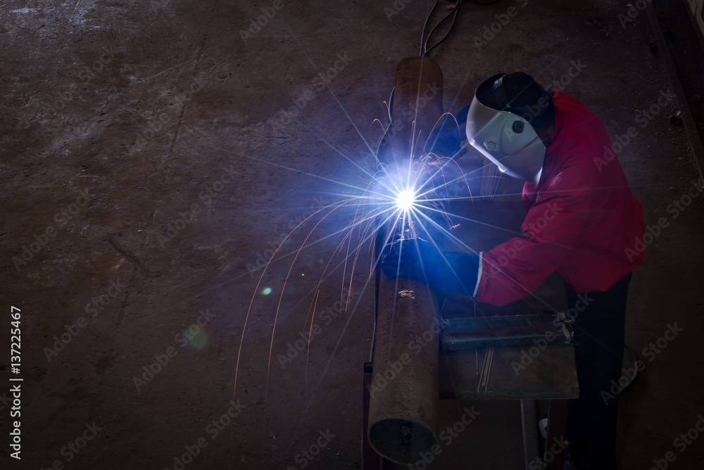 Closeup industrial Worker at the factory welding Closeup industrial Worker at the factory welding