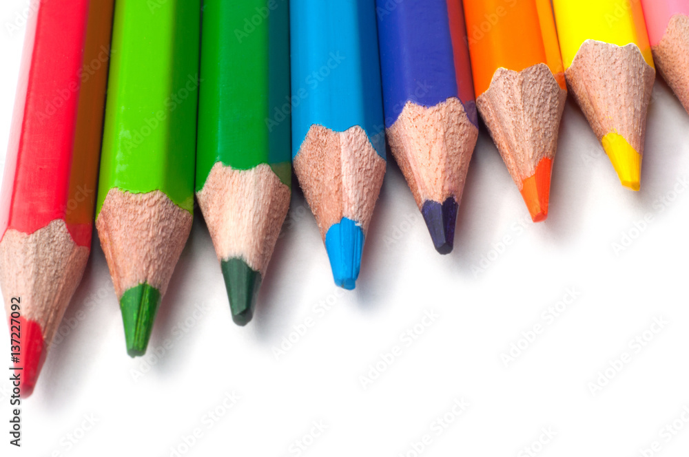 Colored pencils isolated on a white background macro Colored pencils isolated on a white background macro