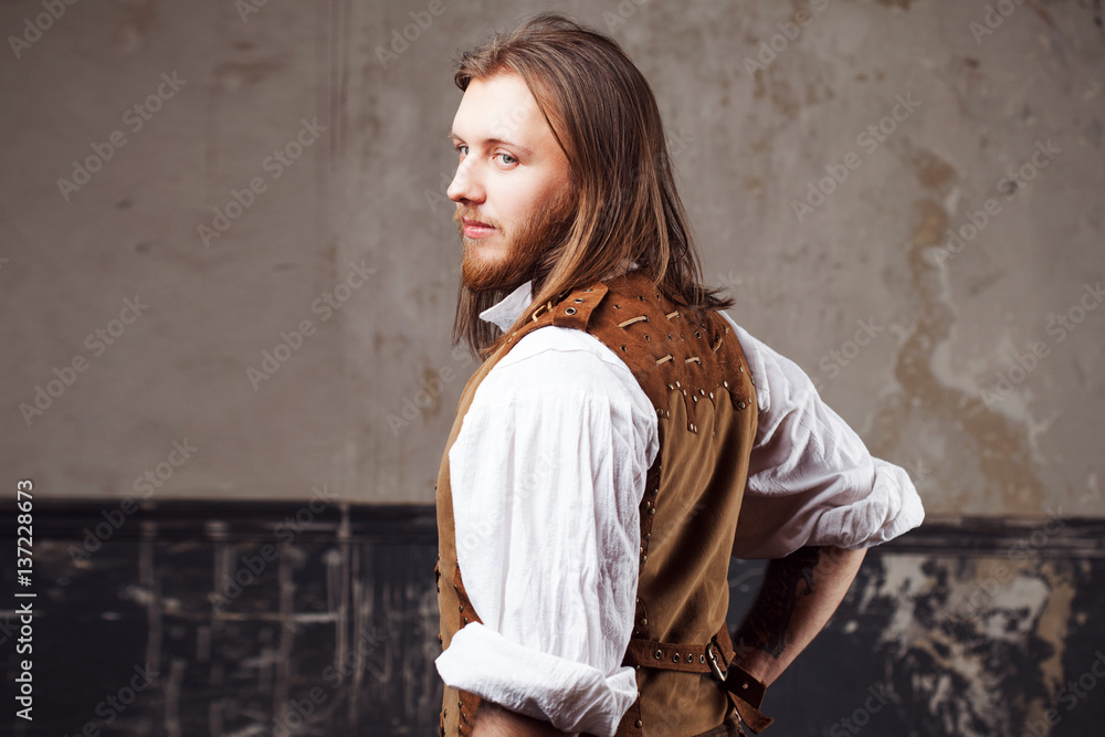 Handsome male Steam punk. Retro man portrait over grunge background. Handsome male Steam punk. Retro man portrait over grunge background.