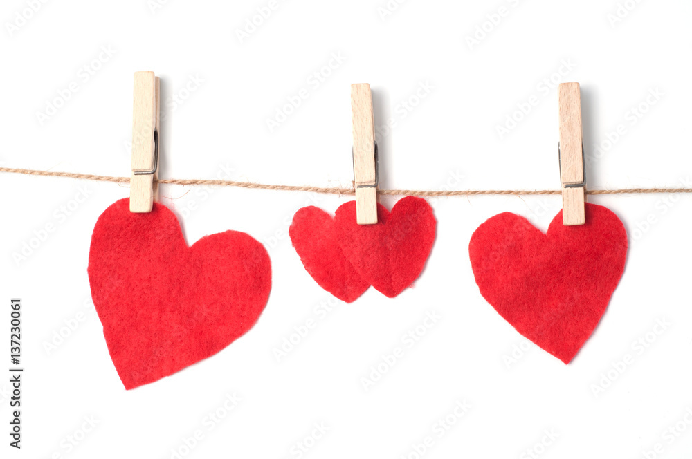 Hearts on a rope with clothespins isolated Hearts on a rope with clothespins isolated