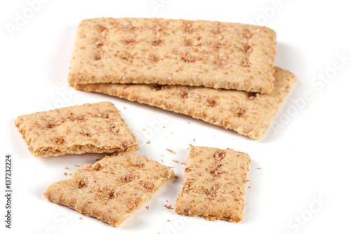 two whole and the broken grain crispbreads isolated on white background