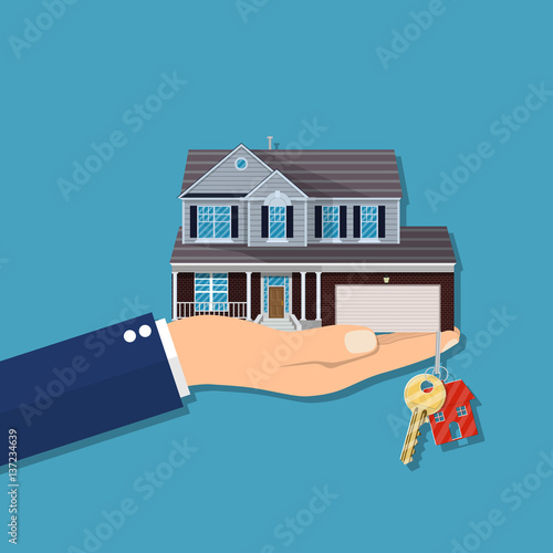 Hand with house and keys