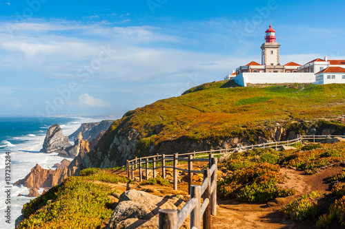 The lighthouse in Cabo da Roca. Cliffs and rocks on the Atlantic ocean coast in Sintra in a beautiful summer day, Portugal