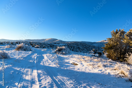 Road that leads to snow mountain, winter landscape