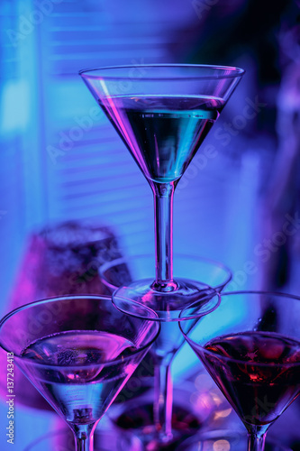 beautiful wine champagne glasse in front of colorful background with shades of blue.