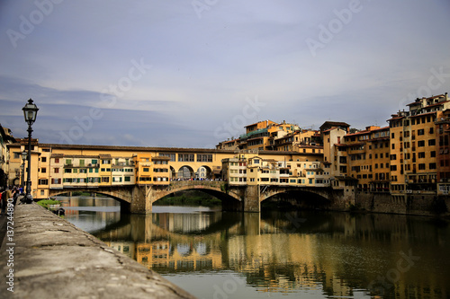 The Ponte Vecchio medieval stone closed-spandrel segmental arch bridge over the Arno River, in Florence, Italy, noted for still © MF1688