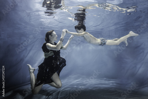 mother with son underwater