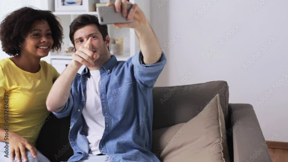 happy couple taking selfie with smartphone at home happy couple taking selfie with smartphone at home