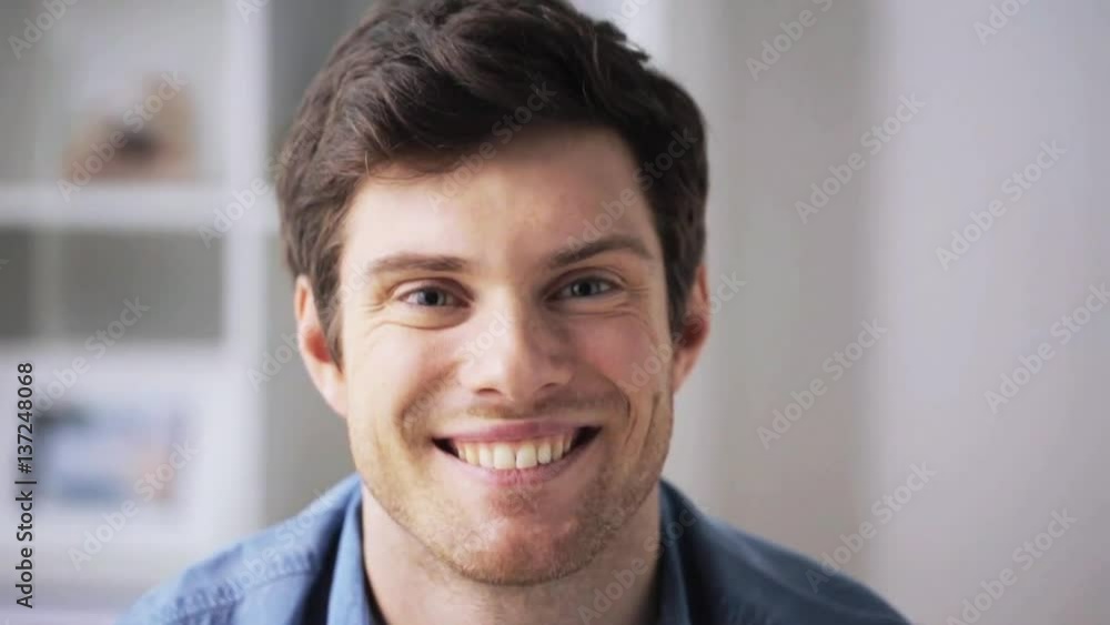 happy smiling young man at home happy smiling young man at home