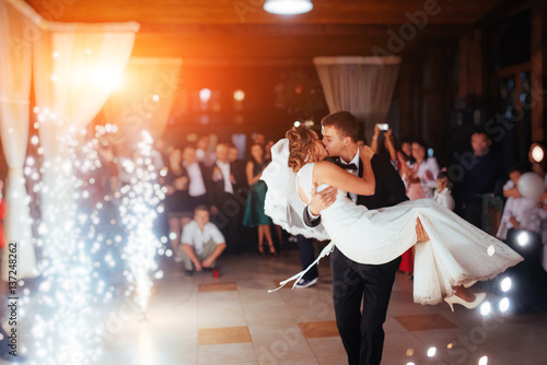 Happy bride and groom a their first dance, wedding photo