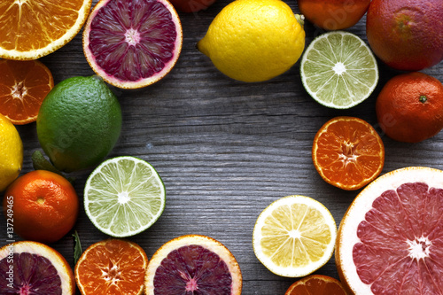 Lemon,red orange, orange, grapefruit,  lime on old wooden table. Background.