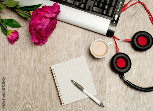 coffee computer and headphones on the desktop. Listen to music and relax. Wish a good day