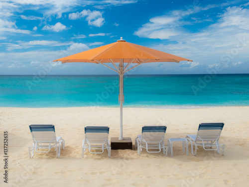Parasol and sun loungers on Seven Mile Beach in the Caribbean  Grand Cayman  Cayman Islands