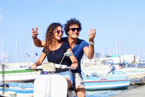 Italian Couple on Scooter Having Fun © courtyardpix