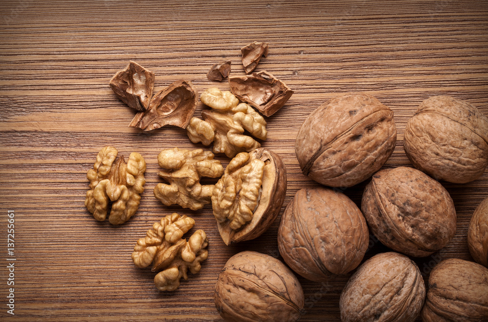 walnuts on wooden table walnuts on wooden table