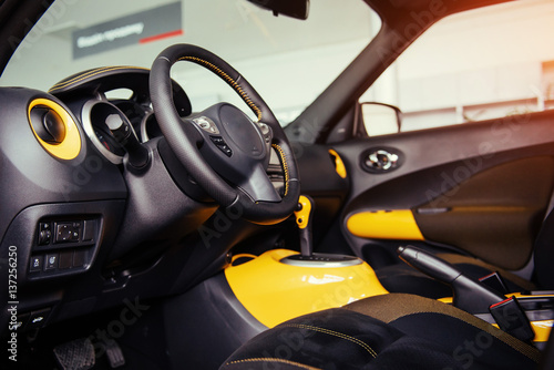 Modern car interior dashboard and steering wheel © standret