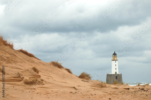 Sand dune and lighthouse, Scotland
