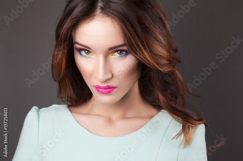 Beautiful young woman with vivid makeup