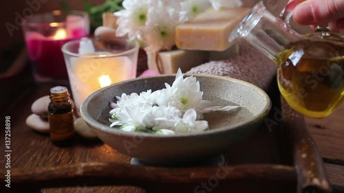 Spa setting.Adding olive oil in the  water for skin treatments .Burning candles and aromatherapy