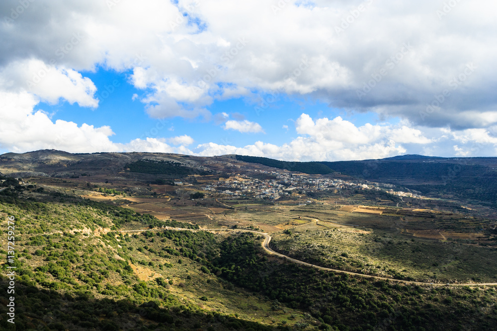 Galilee mountains landscape and small village on the hill, serpentine of roads