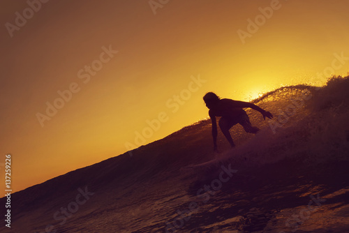Surfer Catching a Wave
