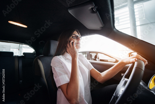 Businesswoman talking on the phone in the car © standret