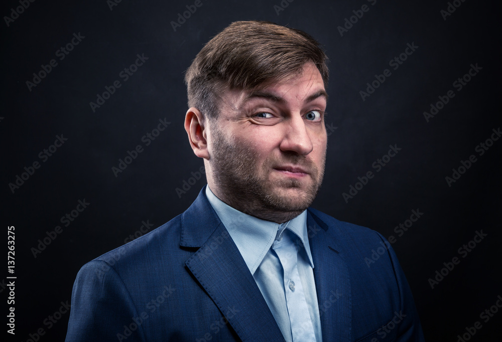 Brutal man in suit on black background Brutal man in suit on black background