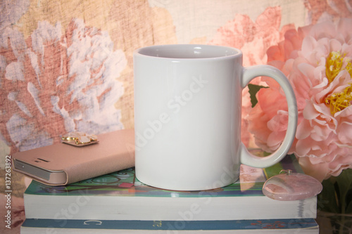 Mock-up of a white mug with some feminine stuff.