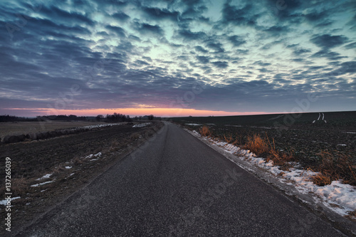 Twilight Sky over Empty Asphalt Road in East Europe
