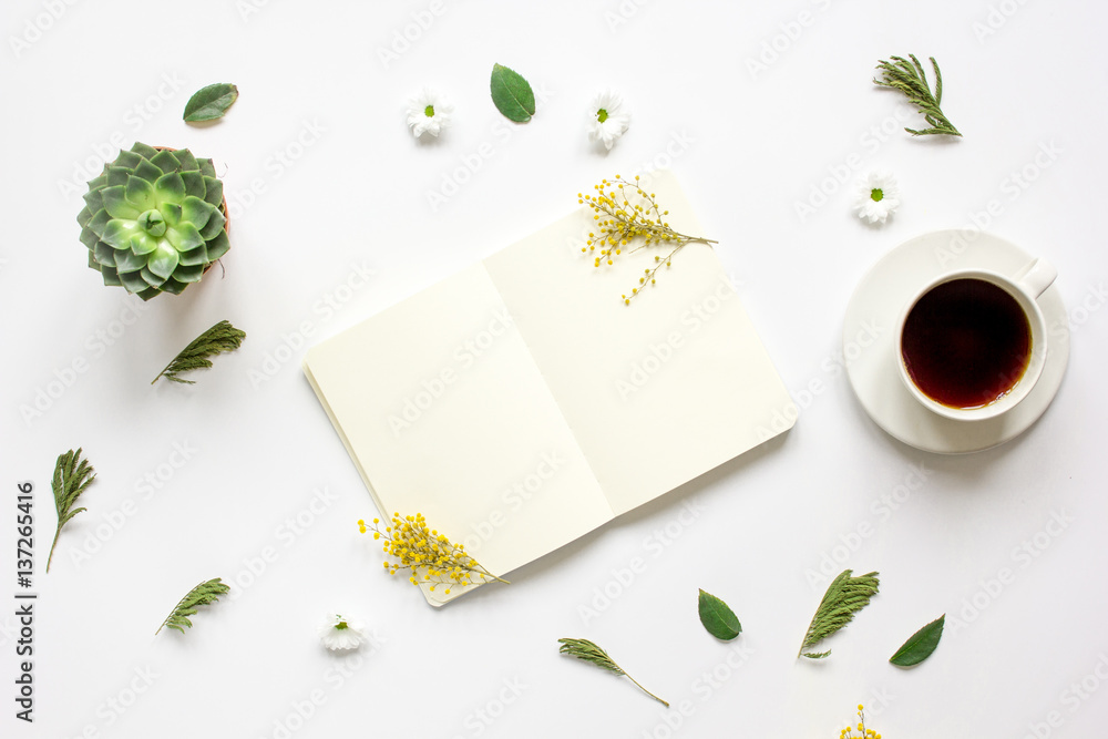 Notebook with cup of coffee on white background top view mockup Notebook with cup of coffee on white background top view mockup