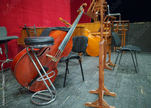 Musical instruments - double bass or contrabass are in the orchestra room. In pending of the musicians before the rehearsal.