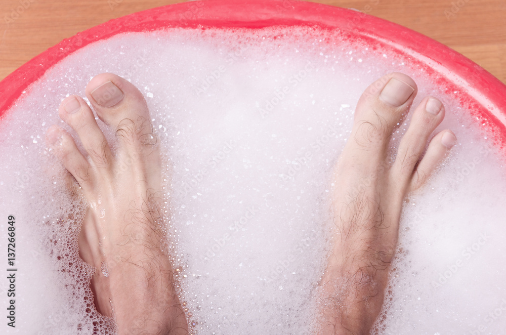 Fototapeta premium feet are bathed in soap