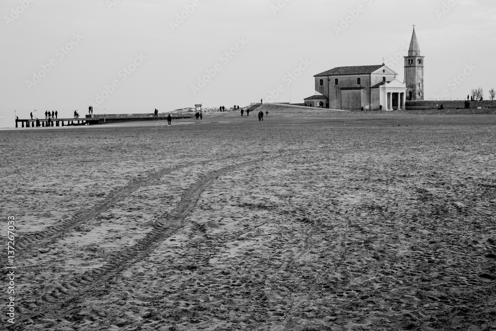 view of isolated church on beach in caorle in winter view of isolated church on beach in caorle in winter