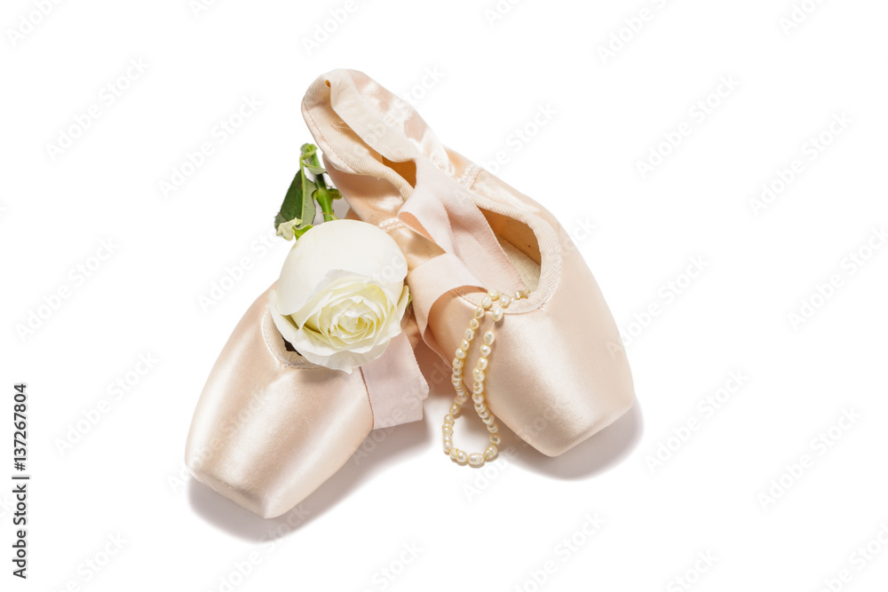 Ballet pointe shoes isolated on white background with white rose Stock