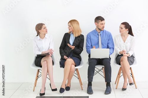 Group of people waiting for job interview in office hall